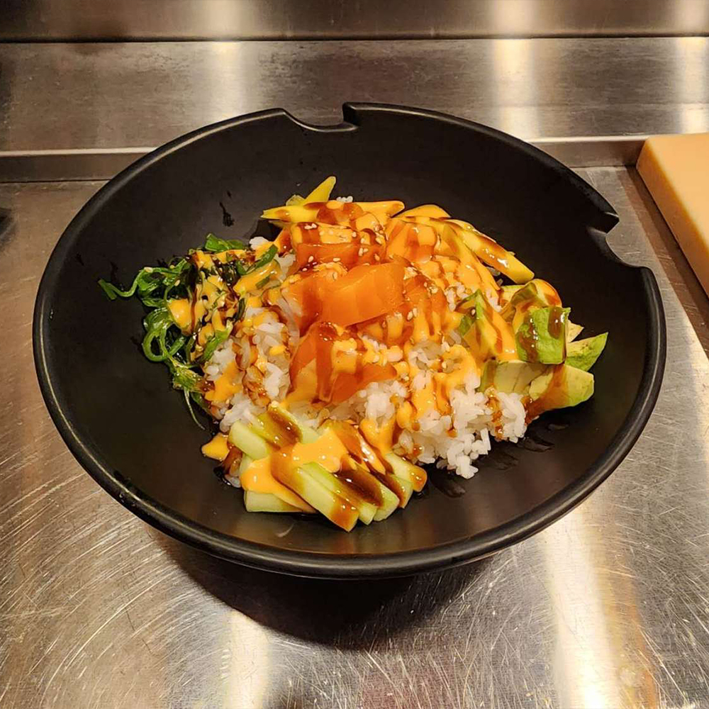 Salmon poke bowl with sushi rice at Asian Sushi Bistro Asian Restaurant in Elkton